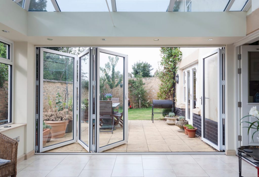 Aluminium bi-folding doors in white