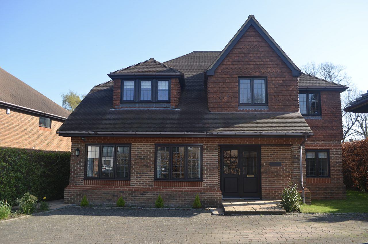 woking home with timber french doors