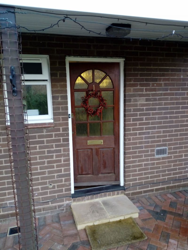 brown timber door before replacement