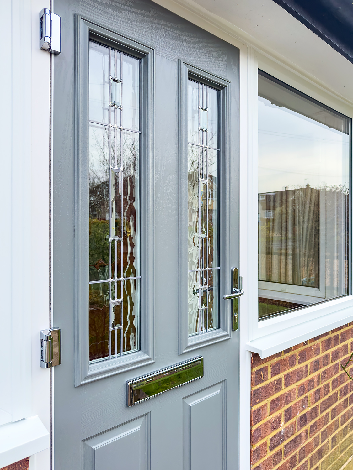 Mouse Grey composite front door and porch side windows